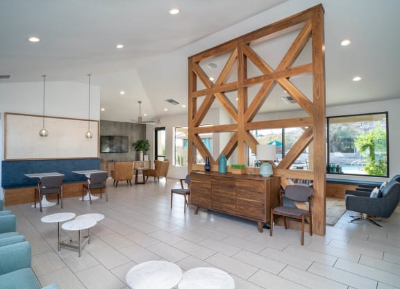 a lobby with a large wooden structure in the middle of the room