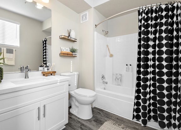 Estancia at Mission Grove Apartments Bathroom with white cabinets