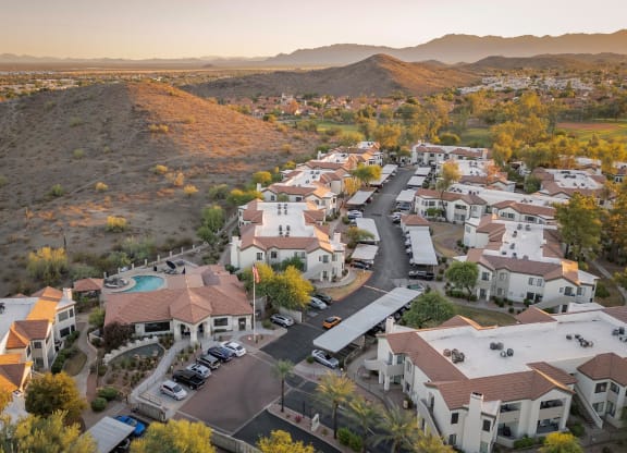 an aerial view of a neighborhood with houses and cars parked on the street