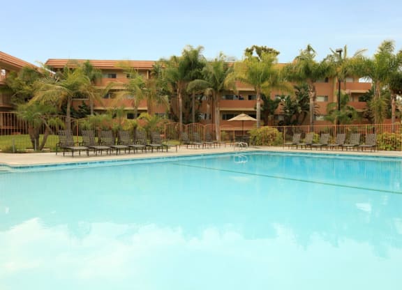 Ocean Breeze Villas Pool with Lounge Chairs