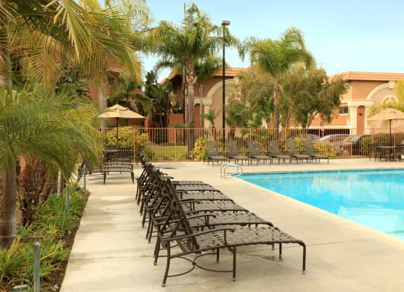 Ocean Breeze Villas Pool with Lounge Chairs