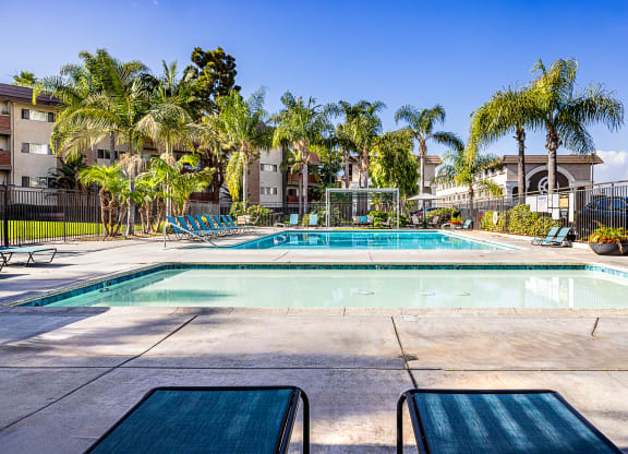 Ocean Breeze Villas Pool with Lounge Chairs