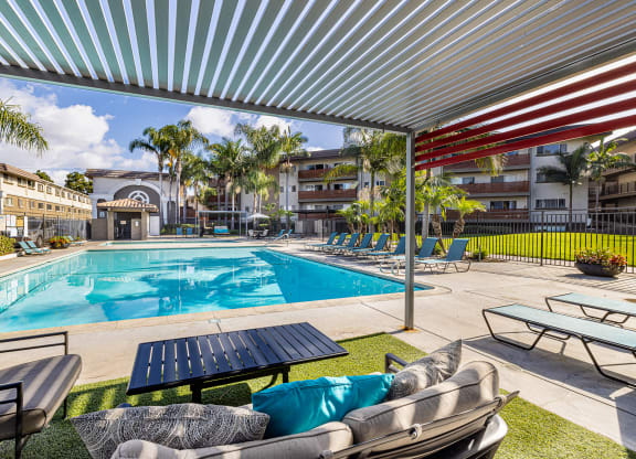 Ocean Breeze Villas Pool with Lounge Chairs