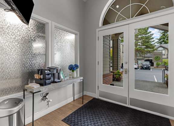 a bathroom with a sink and a glass door