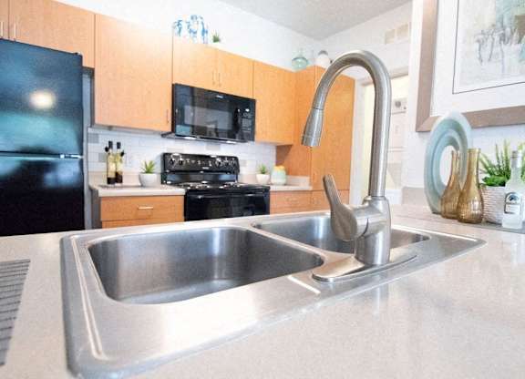 a kitchen with a sink and a faucet