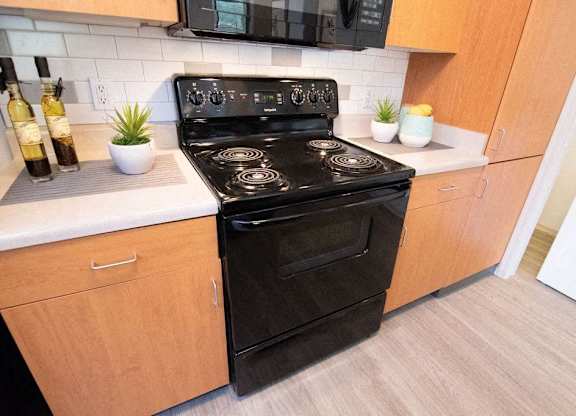 a kitchen with a stove and a microwave