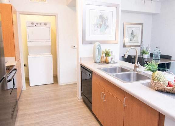 a kitchen with a sink and a counter top