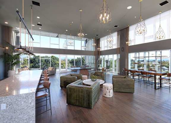 A modern living room with a long marble table and a long sofa.