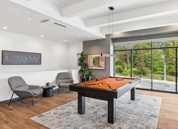 A room with a pool table and chairs at Cru at Willows Apartments, Redmond, Washington, 98052