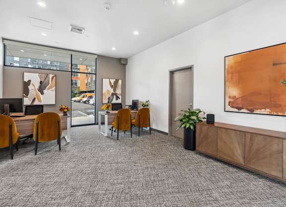 A conference room with a grey carpet and wooden furniture at Cru at Willows Apartments, Redmond, Washington, 98052