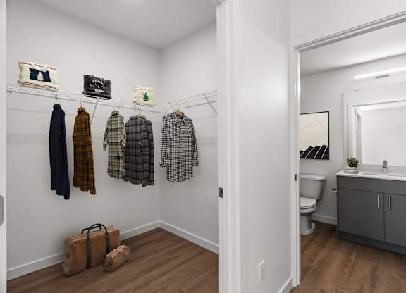 A white room with a wooden floor and a mirror on the wall at Cru at Willows Apartments, Redmond, WA, 98052