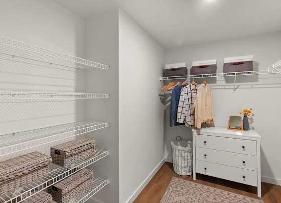 A white closet with a white dresser and a white rug at Cru at Willows Apartments, Redmond, Washington, 98052