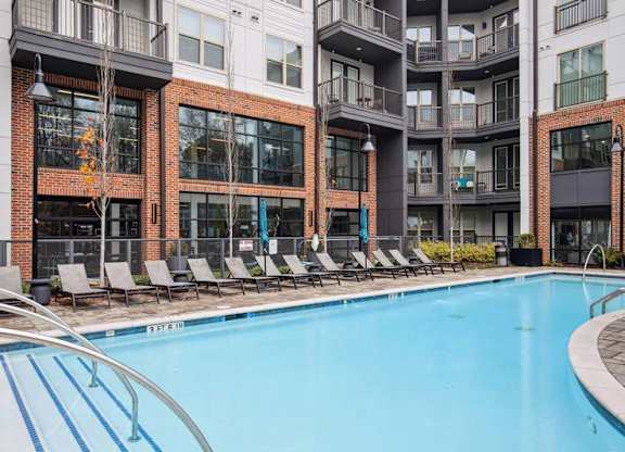 Skye Suwanee Town Center Apartments in Suwanee, Georgia Pool with Lounge Chairs