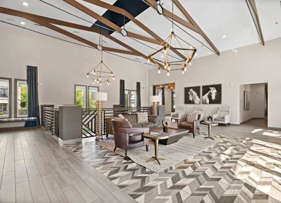 A modern living room with a large rug and a wooden floor.
