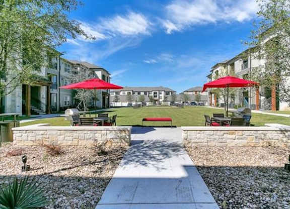 A sunny day at a residential area with a clear blue sky.