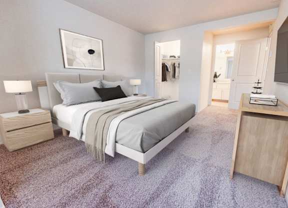 A bedroom with a bed, nightstand, and a carpeted floor.