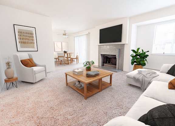 A living room with a fireplace, a couch, a chair, a coffee table, and a television.