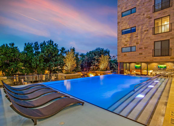 a swimming pool in front of a building