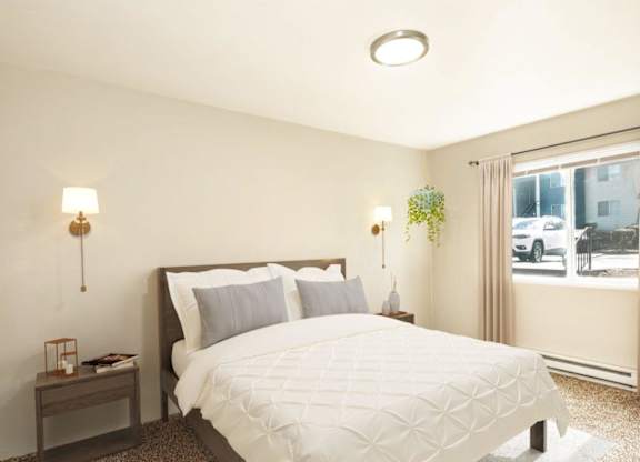 A bedroom with a large bed and a window overlooking a street.