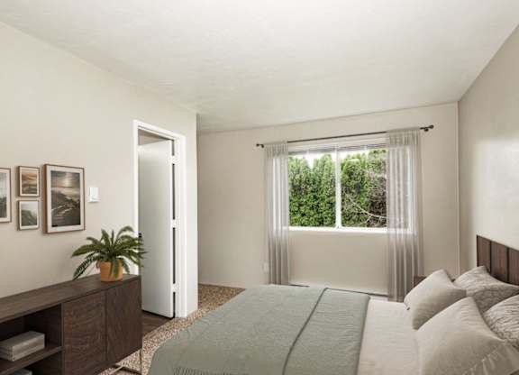 A bedroom with a bed, nightstand, and window with curtains.