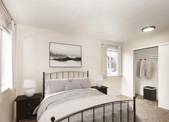 A bedroom with a large bed and a picture on the wall.