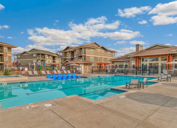 RedPoint Apartments Pool with Lounge Chairs