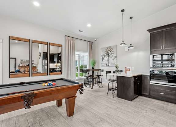 Remington Village Apartments in Gillette, Wyoming Clubhouse Lounge with Kitchen and Pool Table