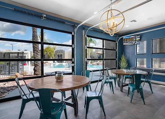 A dining area with a table and chairs.