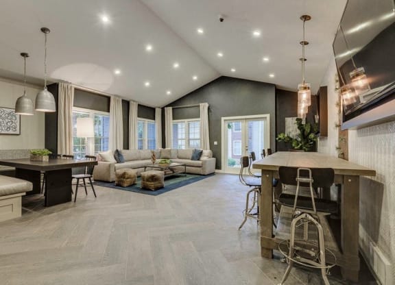 Fulton's Crossing and Landing Apartments clubhouse with large seating areas, tvs and tables
