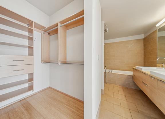 A bathroom with a walk-in shower and a sink.