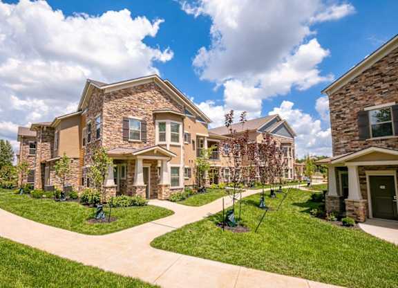 A row of houses with a walkway between them.