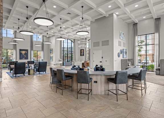 a clubhouse with a bar and dining area with chairs and tables