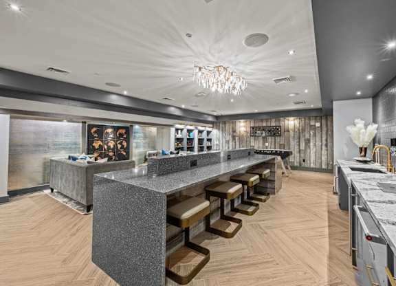 a large granite counter top in a restaurant with a long bar