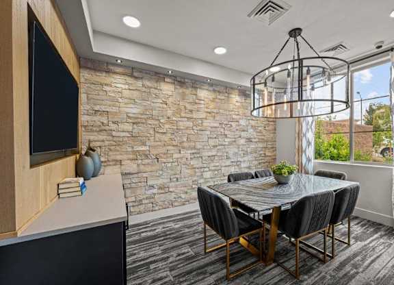 a dining room with a table and chairs