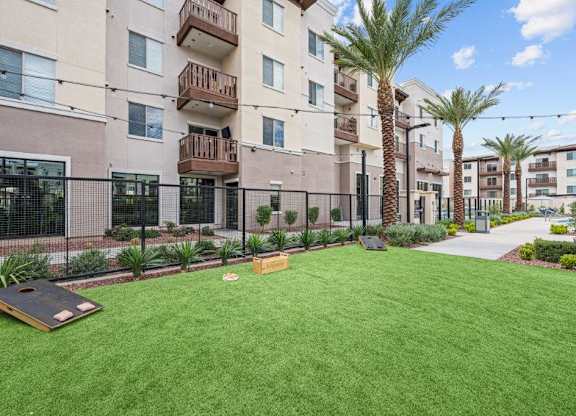 our apartments have a spacious yard with grass and a bocce court