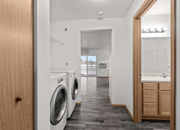 A laundry room with a washer and dryer in it.