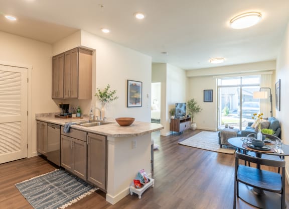 a living room with a kitchen and a dining room