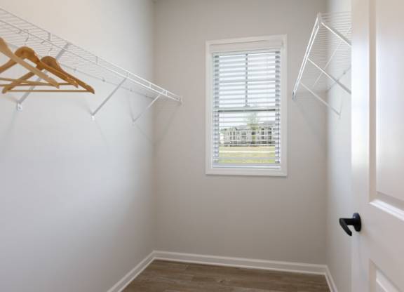 A room with a window and a door.
