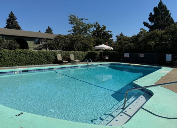 The Clairmont Apartments in Eugene, Oregon Pool with Lounge Chairs
