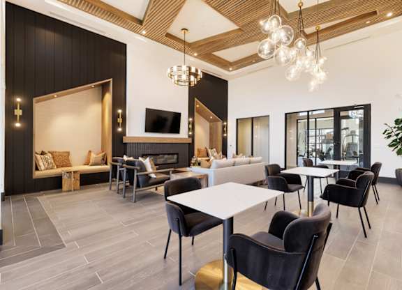 A modern living room with a fireplace and a dining area.