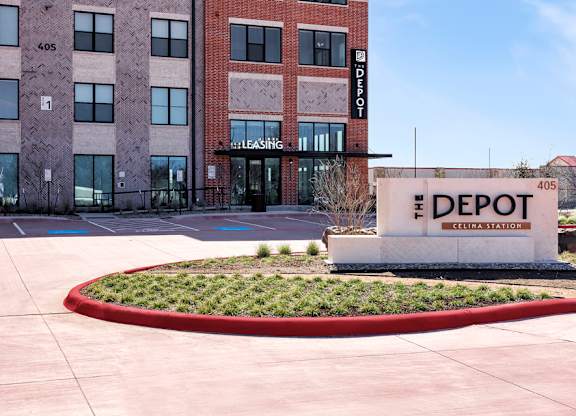 The front of a building with a sign that says