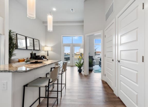 The Edison at Bozeman Gateway Apartments in Bozeman, Montana Model Kitchen and View into Living Room and Bedroom