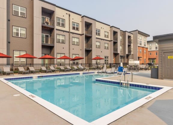 The Edison at Bozeman Gateway Apartments in Bozeman, Montana Pool with Lounge Chairs