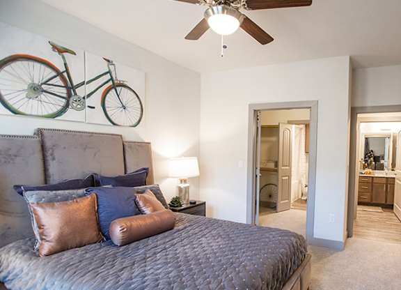 The Flats at Shadowglen Apartments in Manor, TX Model Bedroom with Attached Bathroom