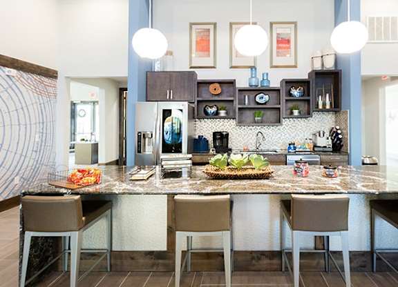 The Flats at Shadowglen Apartments in Manor, TX Clubhouse Kitchen