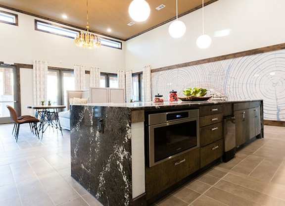 The Flats at Shadowglen Apartments in Manor, TX Clubhouse Kitchen