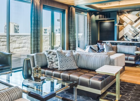 a living room filled with furniture and a large window
