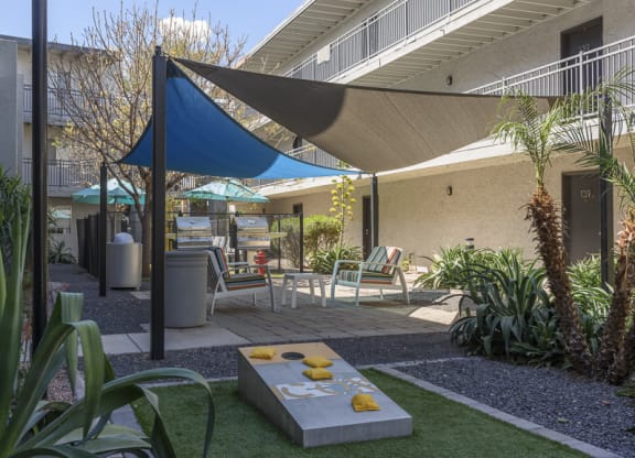 The Icon on Central Apartments in Phoenix, Arizona Patio with BBQ's and Corn Hole
