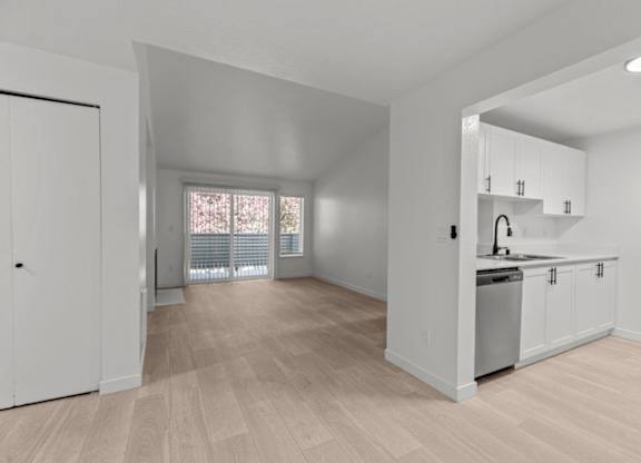 The Marina at Martha Lake Apartments in Bothell, WA Kitchen and View into Living Room