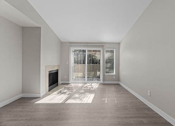 The Marina at Martha Lake Apartments in Bothell, WA Living Room with Fireplace and Private Patio